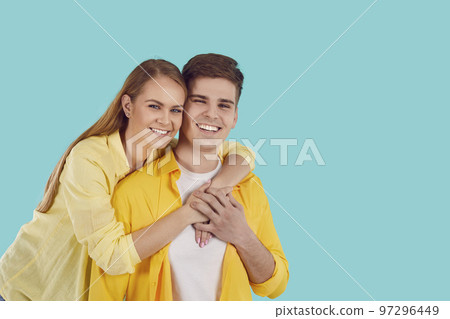 Smiling couple hug posing together 97296449
