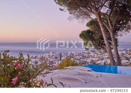 Aerial view of sea point, Cape Town during sunset. The beautiful landscape panorama of South Africa with copy space and sea horizon touching the sky. Scenic view of a town with skyscrapers and trees Aerial view of sea point, Cape Town during sunset. The beautiful landscape panorama of South Africa with copy space and sea horizon touching the sky. Scenic view of a town with skyscrapers and trees 97299153