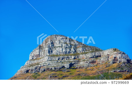 Landscape view of Lions Head mountain, blue sky with copy space on Table Mountain, Cape Town, South Africa. Calm and tranquil countryside with relaxing, wild nature scenery in tourism destination Landscape view of Lions Head mountain, blue sky with copy space on Table Mountain, Cape Town, South Africa. Calm and tranquil countryside with relaxing, wild nature scenery in tourism destination 97299669