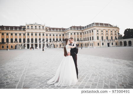 Luxury married wedding couple, bride and groom posing in luxury city Luxury married wedding couple, bride and groom posing in luxury city 97300491