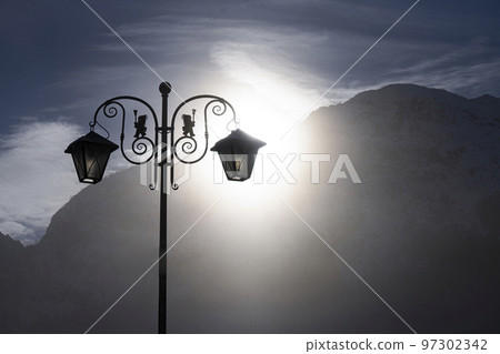 A backlit street lamp 97302342