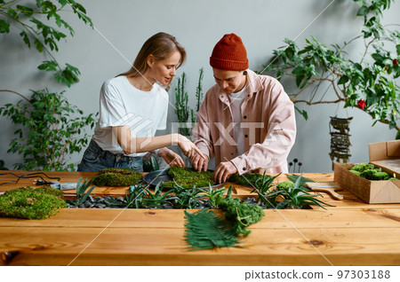 Professional florists working at creative art studio Professional florists working at creative art studio 97303188