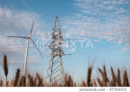Windmill produces energy for supporting transmission lines Windmill produces energy for supporting transmission lines 97304032