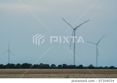 Windmills produce renewable energy for supporting farms Windmills produce renewable energy for supporting farms 97304034