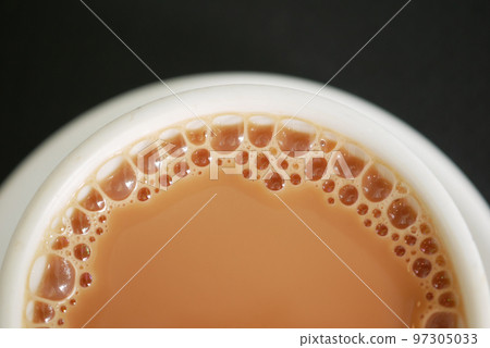 close up of cup of milk tea on table close up of cup of milk tea on table 97305033