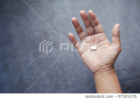 top view of man hand holding pills with copy space top view of man hand holding pills with copy space 97305276