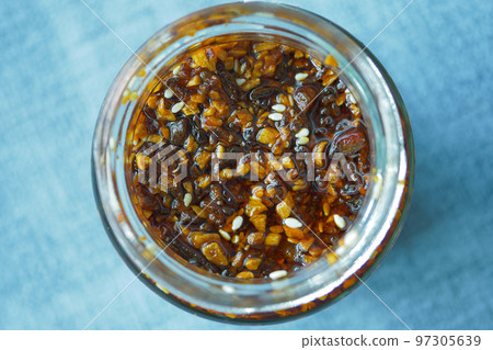 chili and garlic flakes in a container chili and garlic flakes in a container 97305639