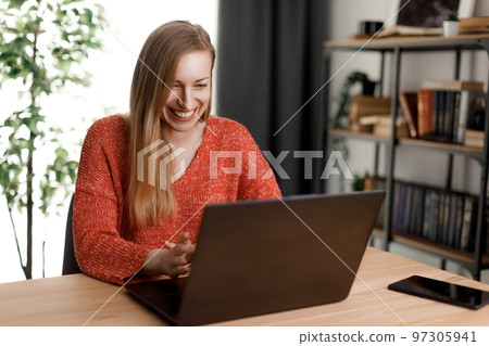Woman working on laptop Woman working on laptop 97305941