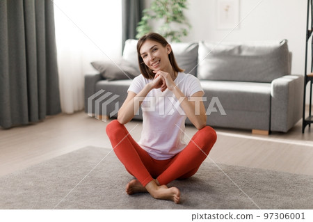 Smiling woman resting during sport 97306001