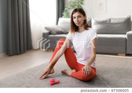 Woman relaxing after training Woman relaxing after training 97306005