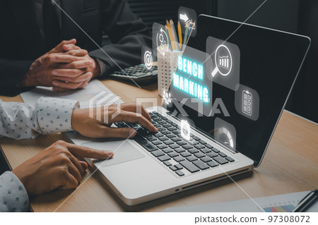 Business concept of benchmark, Business person team working on laptop computer with benchmarking icon on virtual screen, Business, Technology, Internet and network. Business concept of benchmark, Business person team working on laptop computer with benchmarking icon on virtual screen, Business, Technology, Internet and network. 97308072