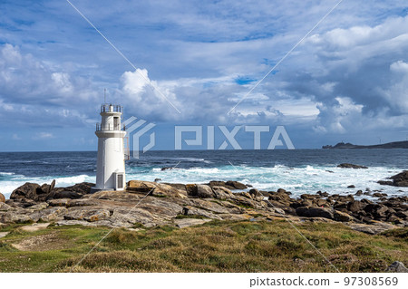 Lighthouse in Muxia on the Costa da Morte in Galicia, Spain. Cape Vilan in the background 97308569