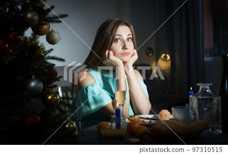 Sad woman celebrating Christmas 97310515