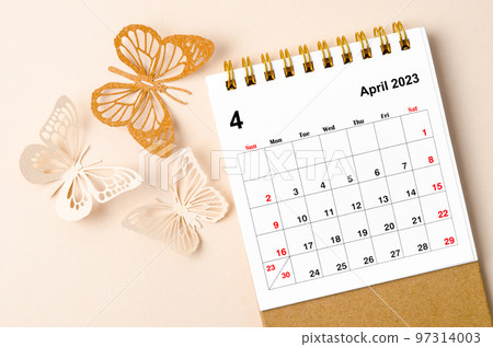 A April 2023 desk calendar for the organizer to plan and reminder and butterfly paer on yellow background. A April 2023 desk calendar for the organizer to plan and reminder and butterfly paer on yellow background. 97314003
