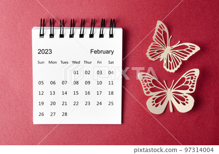 The February 2023 desk calendar for the organizer to plan and reminder with paer butterfly on red background. 97314004