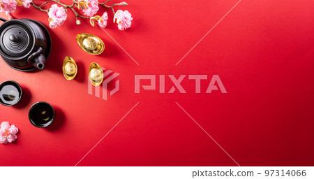 Chinese new year decorations made from red packet, orange and gold ingots or golden lump on a red background. Chinese characters FU in the article refer to fortune good luck, wealth, money flow. Chinese new year decorations made from red packet, orange and gold ingots or golden lump on a red background. Chinese characters FU in the article refer to fortune good luck, wealth, money flow. 97314066