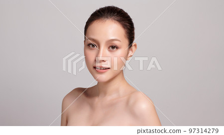 Beautiful young asian woman with clean fresh skin on grey background, Face care, Facial treatment, Cosmetology, beauty and spa, Asian women portrait. Beautiful young asian woman with clean fresh skin on grey background, Face care, Facial treatment, Cosmetology, beauty and spa, Asian women portrait. 97314279
