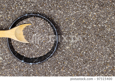 Healthy food, Chia seeds in black bowl with wooden spoon on chia seeds or superfood background Healthy food, Chia seeds in black bowl with wooden spoon on chia seeds or superfood background 97315400