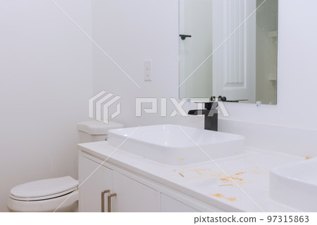 Bathroom with marble sink and shower curtain. Beautiful new master bathroom. 97315863