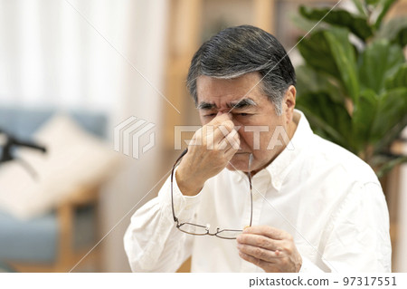 Senior man with tired eyes Senior man with tired eyes 97317551