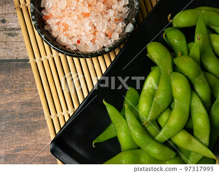 The edamame on black plate for food concept The edamame on black plate for food concept 97317995