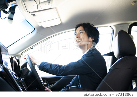 A man driving a car 97318862