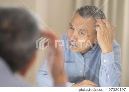 Senior man who cares about hair Senior man who cares about hair 97320197