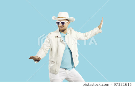 Funny man in white leather jacket, hat and sunglasses dancing isolated on blue background Funny man in white leather jacket, hat and sunglasses dancing isolated on blue background 97321615