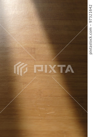 Sunlight and shadows illuminating the wooden flooring Sunlight and shadows illuminating the wooden flooring 97321642