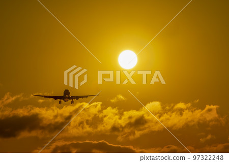 sun and sunset with aircraft landing sun and sunset with aircraft landing 97322248