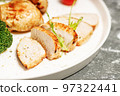 Close-up Turkey breast meat and broccoli on a white plate. Delicious and healthy food. KETO diet concept. Copy space 97322441