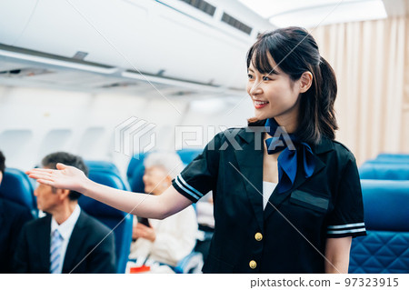 Cabin attendant working on board 97323915