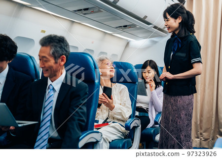 Cabin attendant working on board Cabin attendant working on board 97323926