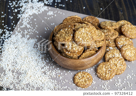 oatmeal thin round cookies with lots of sesame seeds oatmeal thin round cookies with lots of sesame seeds 97326412
