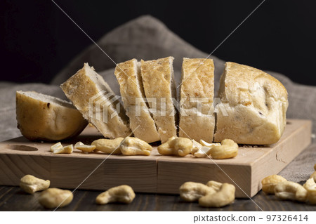 Sliced wheat loaf of fresh bread Sliced wheat loaf of fresh bread 97326414