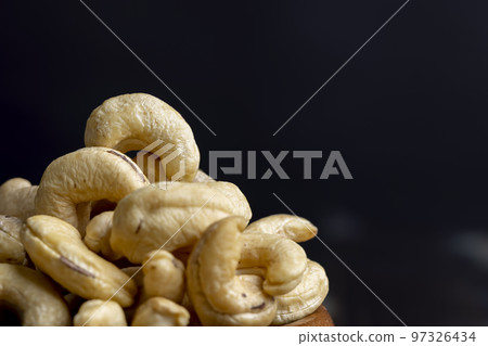 fresh cashew nuts on the table 97326434