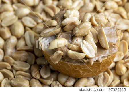 Peanut paste on a soft wheat baguette Peanut paste on a soft wheat baguette 97326615