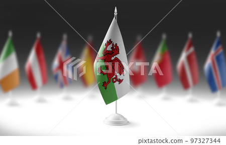 The national flag of the Wales on the background of flags of other countries 97327344