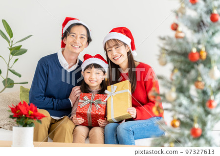 young family at christmas 97327613