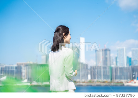 Businesswoman walking outside Businesswoman walking outside 97327790