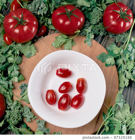 fresh red tomatoes on a white plate. fresh red tomatoes on a white plate. 97329188