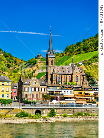 Landscape of Lorchhausen town in the Rhine Gorge with Saint Boniface Church in Germany 97331045