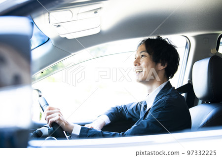 A man driving a car 97332225