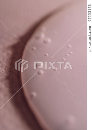 A drop of shampoo on a pink background. A drop of shampoo on a pink background. 97333178