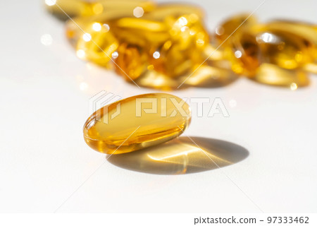 Oil filled capsules on the white background 97333462