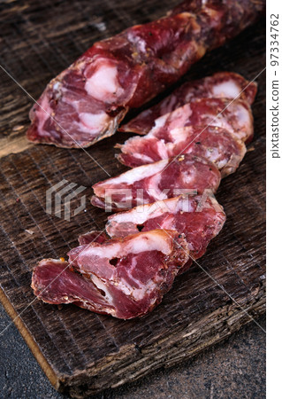 Traditional Spanish sausage feet on th cutting board Traditional Spanish sausage feet on th cutting board 97334762