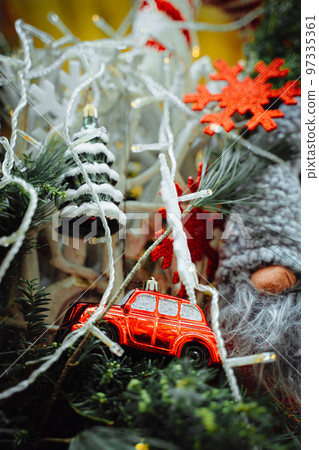 Red car, snowflake and Christmas tree on pine braches 97335361