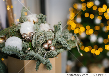 Christmas composition of fir branches, Christmas balls and cotton bolls. Selective focus. Copy space. 97339933