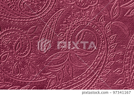 Texture of genuine leather close-up embossed floral pattern. Trending Viva Magenta color. Abstract background 97341167
