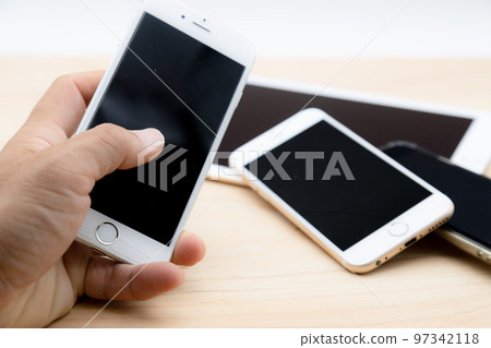 Electronic device Communication device Holding a smartphone in hand 97342118